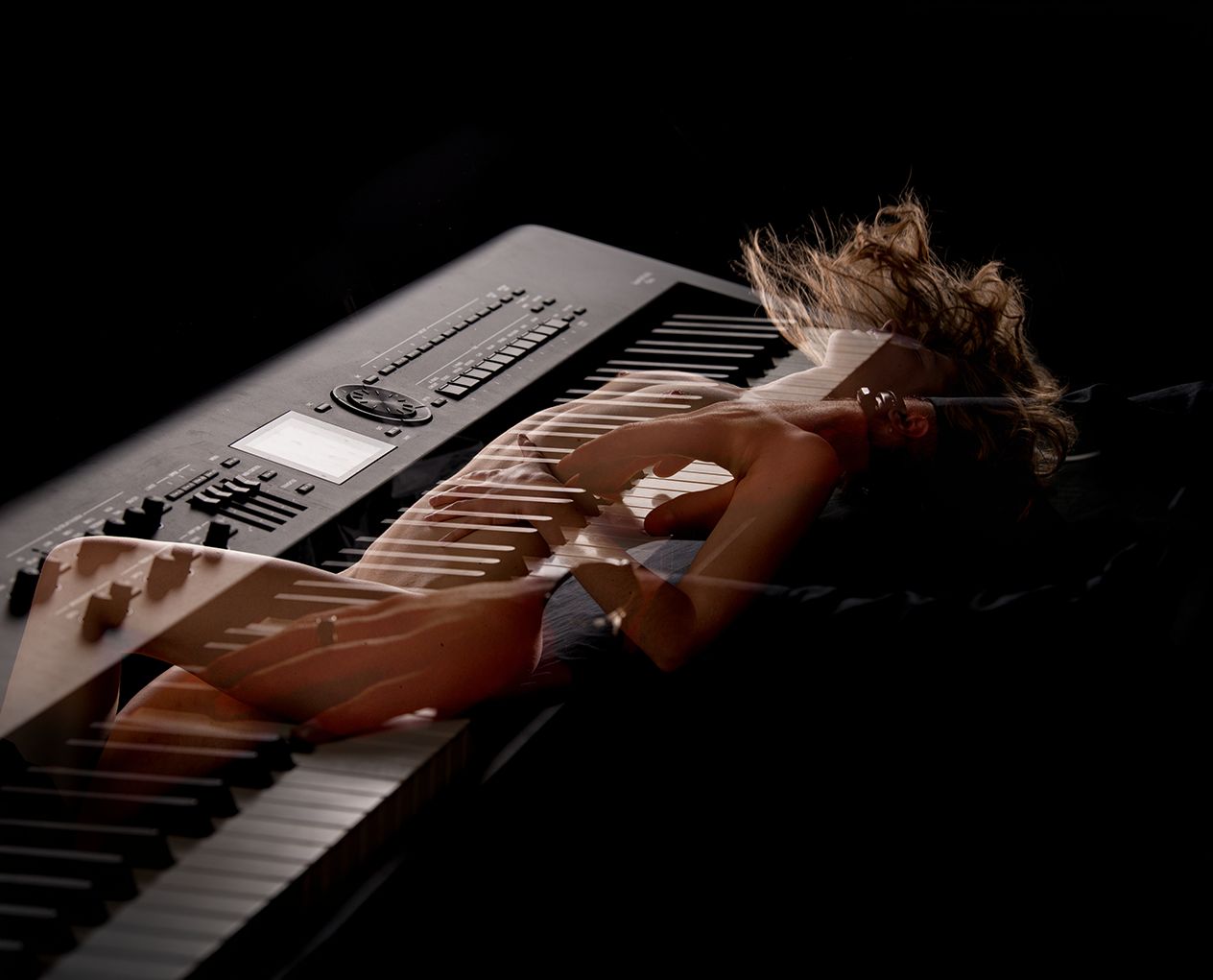 Female body and keyboard in negative overlay — photography, mixed media, 2026